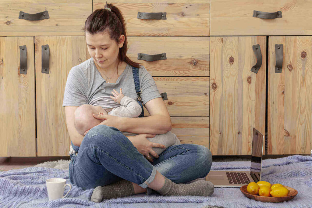mother breast feeding baby